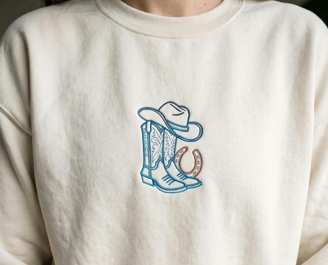 Cowboy_boots_and_western_hat_in_horseshoe_col_img_1792387133.jpeg